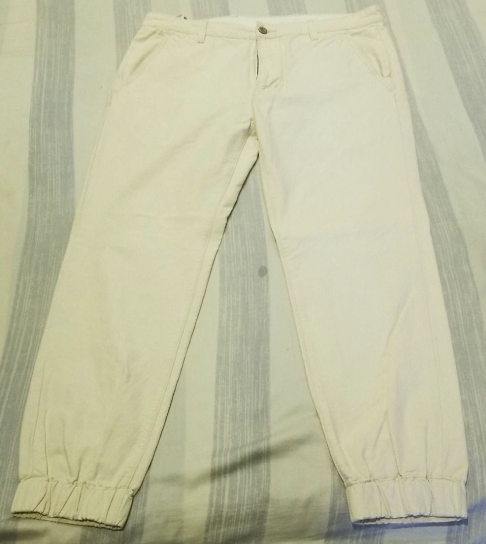 Levi's Cream Chino Jogger Pants (Category: Joggers) located in Quezon City. Submitted by eman438600 (Listing ID 1457840581, Image 1). Description: - Brand: Levi's - Color: Cream - Style: Chino Jogger Pants - Features: Elasticated cuffs, button and zip front closure, two side pockets, one buttoned back pocket - Occasion: Casual wear - Styling: Easy to pair with any top.