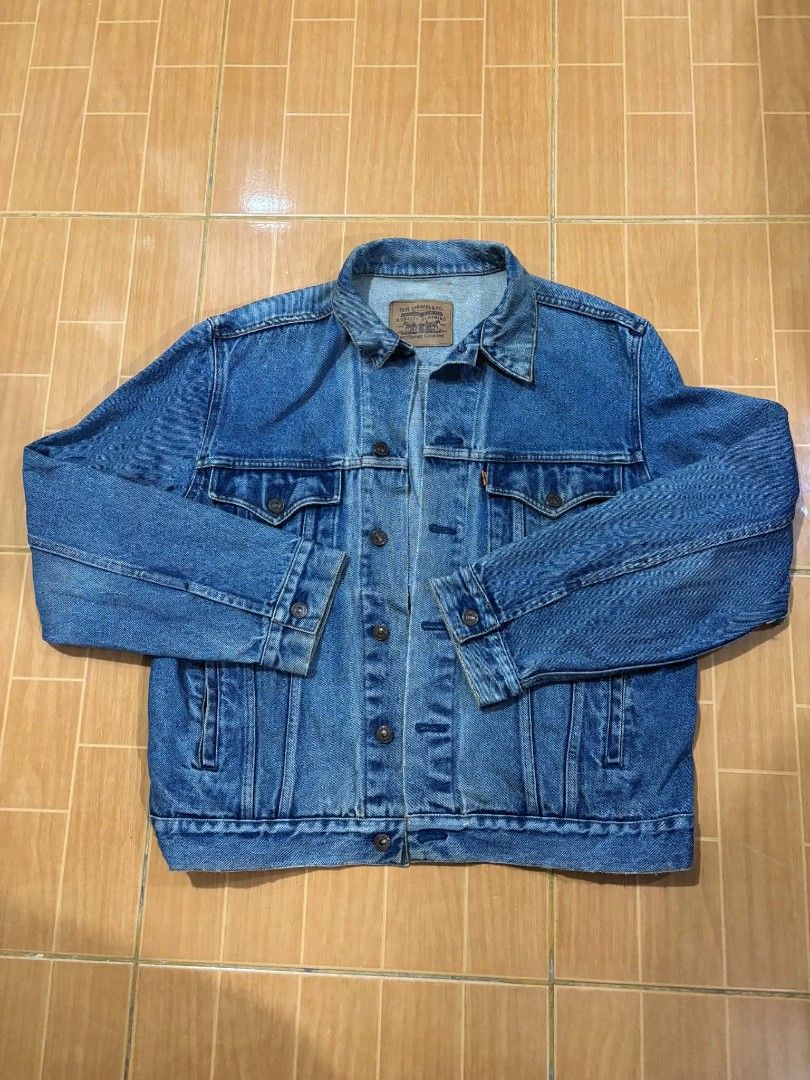 Levi's Denim Jacket - Classic Blue (Category: Coats, Jackets and Outerwear) located in Paranaque City. Submitted by poego (Listing ID 1457783819, Image 1). Description: - Classic blue Levi's denim jacket - Two chest pockets with button closure - Button front and cuffs - Standard trucker jacket style - Perfect for layering or wearing solo - A versatile addition to any wardrobe.