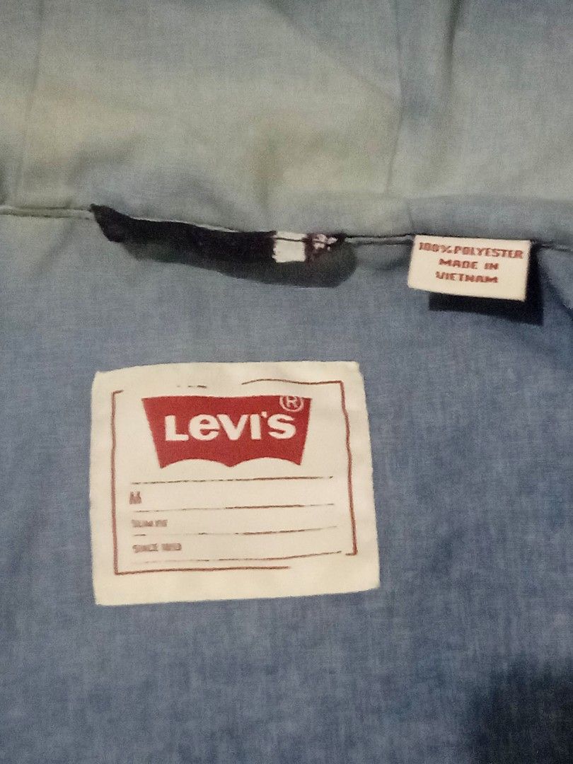 Levi's Striped Hooded Zip Jacket (Category: Coats, Jackets and Outerwear) located in Mandaluyong City. Submitted by bamibiston (Listing ID 1457888266, Image 2). Description: Levi's Jacket (used) Size medium on tag W 55 |L 68 Good conditon Issue: discoloration sa loob ng hood (nasa pic) Material: 100% Polyester Personal item (not thrifted) 09055402866 Mandaluyong loc .