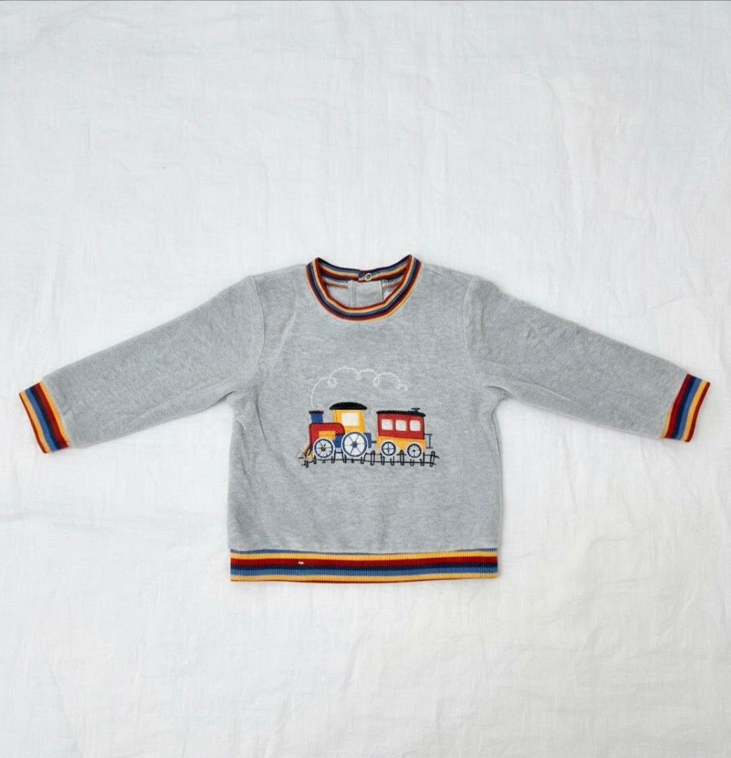 Little Me Grey Train Sweatshirt 24 Months (Category: Babies & Kids Fashion) located in General Trias. Submitted by sscaparas (Listing ID 1457860709, Image 1). Description: - Brand: Little Me - Color: Grey - Size: 24 months - Design: Cute train embroidery on the front - Details: Ribbed cuffs and hem with colorful stripes - Condition: Great for your little one.