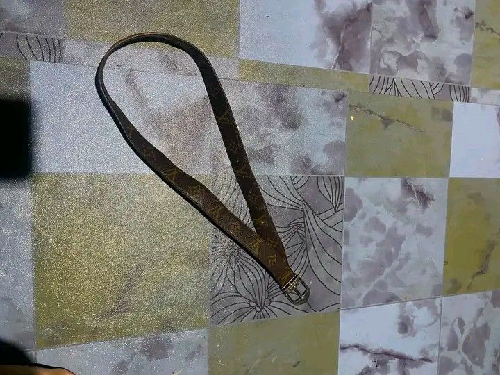 Louis Vuitton Monogram Reversible Belt (Category: Belts) located in Manila. Submitted by bright.mayess (Listing ID 1457897604, Image 3). Description: - Classic Louis Vuitton belt - Reversible: Monogram canvas on one side, plain brown leather on the other - Silver buckle - Versatile accessory for any outfit.