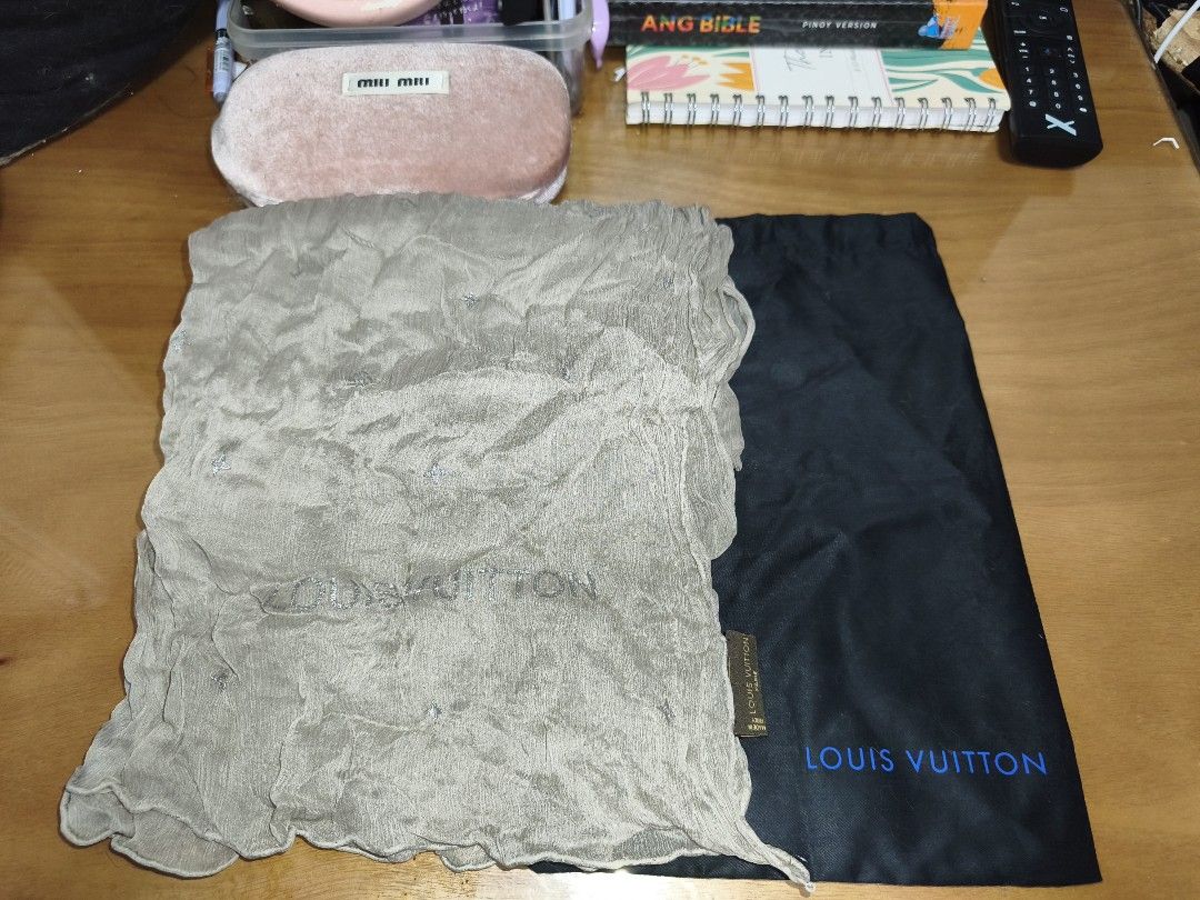 Louis Vuitton Scarf Silk Grey (Category: Scarves) located in Bulacan. Submitted by THA_D_THRIFT (Listing ID 1457836950, Image 1). Description: - Authentic Louis Vuitton scarf - Made in Italy - 100% Silk - Color: Light Grey with subtle sparkle details - Comes with Louis Vuitton dust bag - A versatile accessory to elevate any look 3500 + LALAMOVE/J&T.