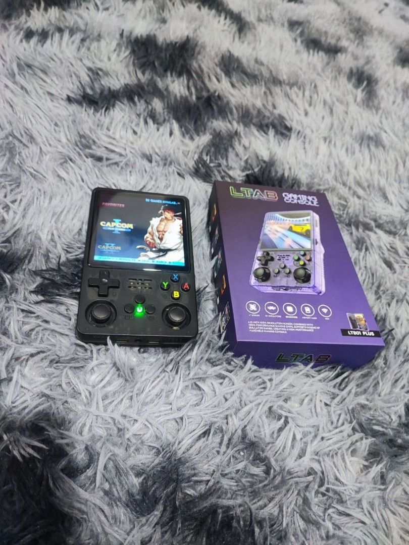 LTAB Handheld Gaming Console (Category: Others) located in Quezon City. Submitted by ladytaurus87416 (Listing ID 1457764960, Image 2). Description: - Includes original box and receipt - Ideal for portable retro gaming adventures.