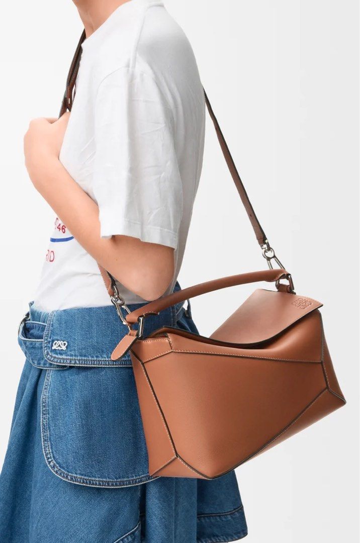 Medium Puzzle Edge bag in classic calfskin (Category: Luxury Bags & Wallets) located in Manila. Submitted by minalimmm (Listing ID 1457781581, Image 2). Description: - Loewe Puzzle Bag - Small Size - Color: Tan - Material: Genuine Leather - Wearable as Shoulder Bag or Crossbody - Ideal for Everyday Use.