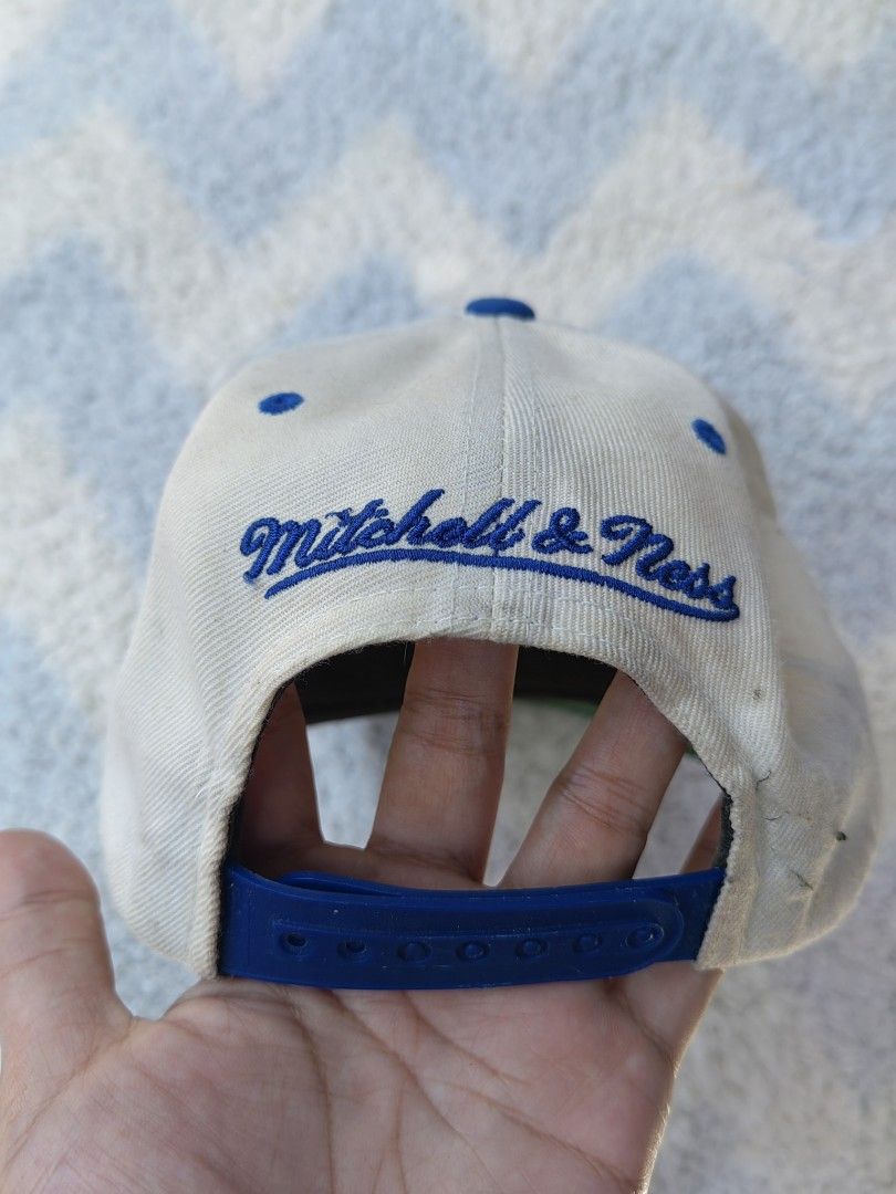Mitchell & Ness New York Giants Vintage Snapback Cap (Category: Caps & Hats) located in Quezon City. Submitted by chicberry (Listing ID 1457823963, Image 3). Description: - Vintage Mitchell & Ness New York Giants snapback cap - Classic cream and blue colorway - Adjustable snapback closure - Perfect for any Giants fan - Shows some signs of wear (please check photos for condition).