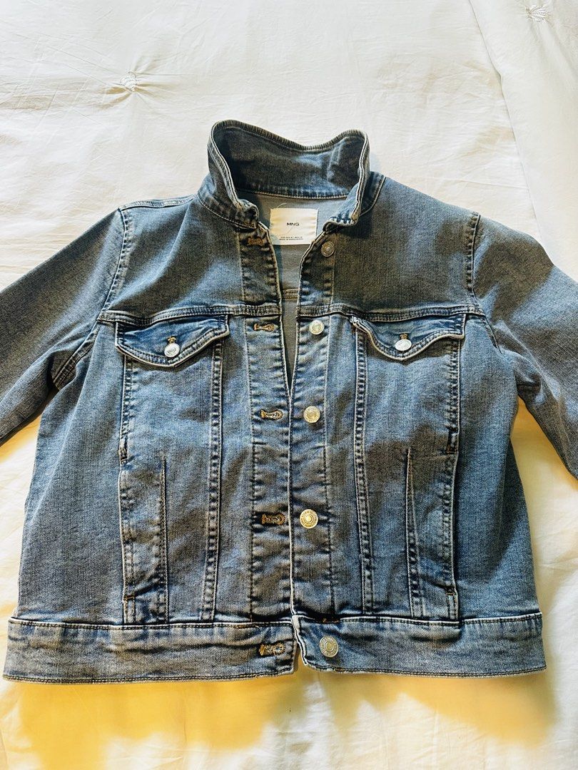 MNG Denim Jacket Blue Size M (Category: Coats, Jackets and Outerwear) located in Muntinlupa City. Submitted by nptorres (Listing ID 1457748562, Image 3). Description: - Classic blue denim jacket from MNG - Size: Medium (M) - Button-up front closure - Two chest pockets - Long sleeves with button cuffs - Versatile for layering over any outfit - Made in Bangladesh.