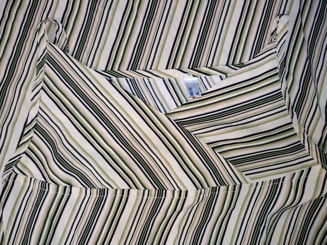 MYSHEROS striped slip dress (Category: Dresses) located in Caloocan City. Submitted by faesrie (Listing ID 1457746215, Image 2). Description: - Stylish V-neck slip dress - Features chic beige, black, and green stripes - Delicate spaghetti straps - Lightweight and flowy fabric for comfort - Versatile for casual or dressed-up looks.