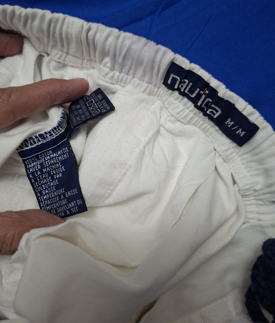 Nautica Deck Short (Category: Activewear) located in Antipolo. Submitted by d.tuazon (Listing ID 1457864383, Image 3). Description: This is a vintage off-white Nautica cotton elastic-waist shorts featuring a rear flapped pocket with the brand's classic logo embroidery.The exact retail price depends heavily on the production era and where you buy them: Vintage Resale Price: If these are a vintage 90s or early 2000s pair of cotton rigger/deck short