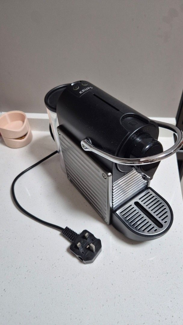 Nespresso Pixie Machine (Category: Coffee Machines & Makers) located in Singapore. Submitted by new.native (Listing ID 1457822786, Image 1). Description: - Black Nespresso coffee machine - Compact and space-saving design - Simple and easy to operate - Ideal for small kitchens Letting go to upgrade to another machine. Open to slight nego and self collect at seller's place..