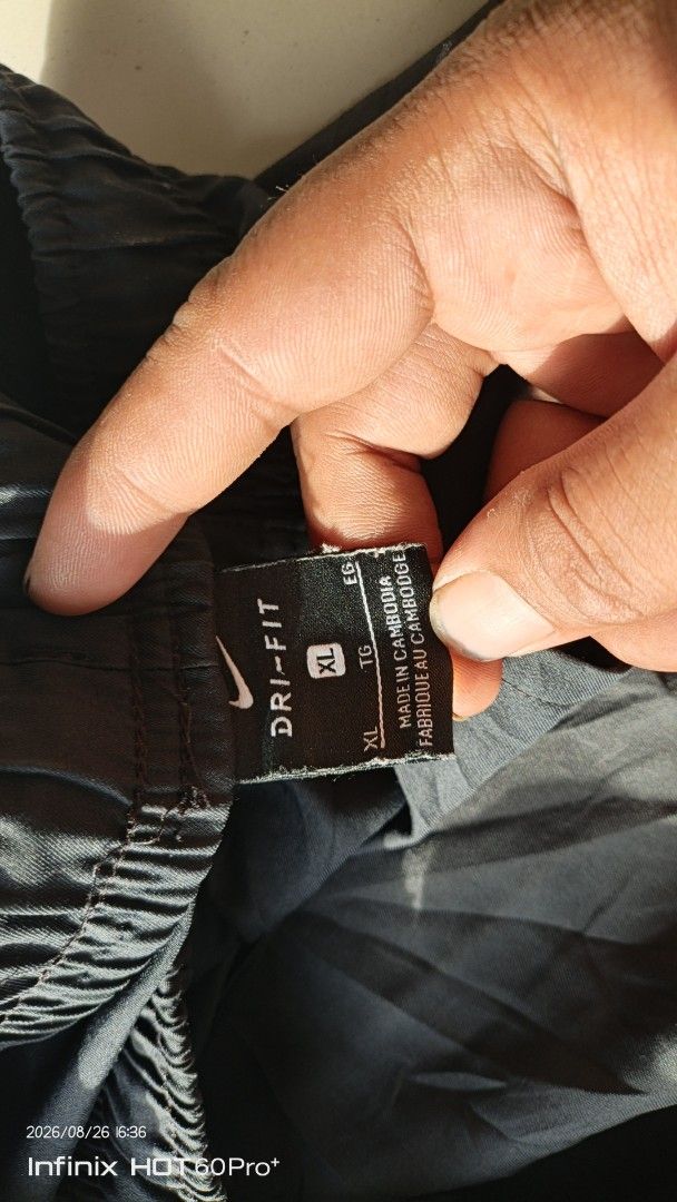 Nike Dri-Fit XL Grey Athletic Pants (Category: Joggers) located in Manila. Submitted by treblig. (Listing ID 1457787083, Image 3). Description: - Grey Nike Dri-Fit athletic pants - Size XL - Elastic waistband with drawstring - Made in Cambodia - Perfect for workouts or casual wear.