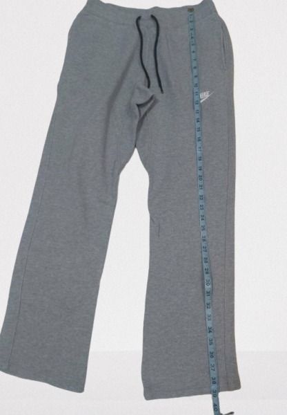 NIKE Grey Sweatpants with Red Logo Detail (Category: Joggers) located in Davao. Submitted by rosewyn (Listing ID 1457781377, Image 3). Description: - Comfortable grey sweatpants - Casual and versatile for lounging or workouts - Features a wide leg style - Elastic waistband for a perfect fit - Subtle red logo detail on the back pocket.