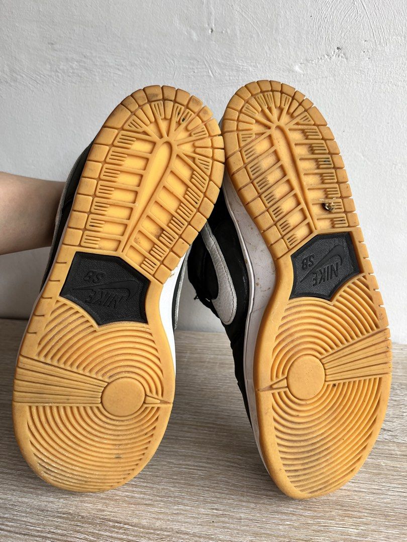 Nike SB Dunk Low Pro Black Gum (Category: Sneakers) located in Bulacan. Submitted by spring_cleaning_ (Listing ID 1457844267, Image 2). Description: - Nike SB Dunk Low Pro - Color: Black and Gum - Size: US 8 - Origin: Made in Vietnam - Condition: Used, with visible wear on toe box and laces - Sole: Good tread remaining - Ideal for: Skating or casual wear.