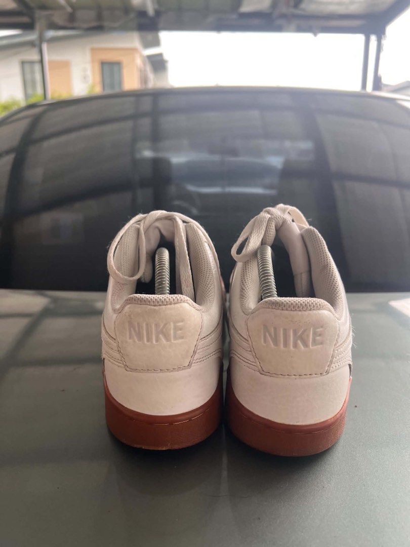 Nike White Leather Sneakers Gum Sole (Category: Sneakers) located in Tanza. Submitted by euniceericka (Listing ID 1457722086, Image 3). Description: - Classic white Nike sneakers - Retro gum sole - Perfect for daily wear - Well used - RFS: Decluttering.