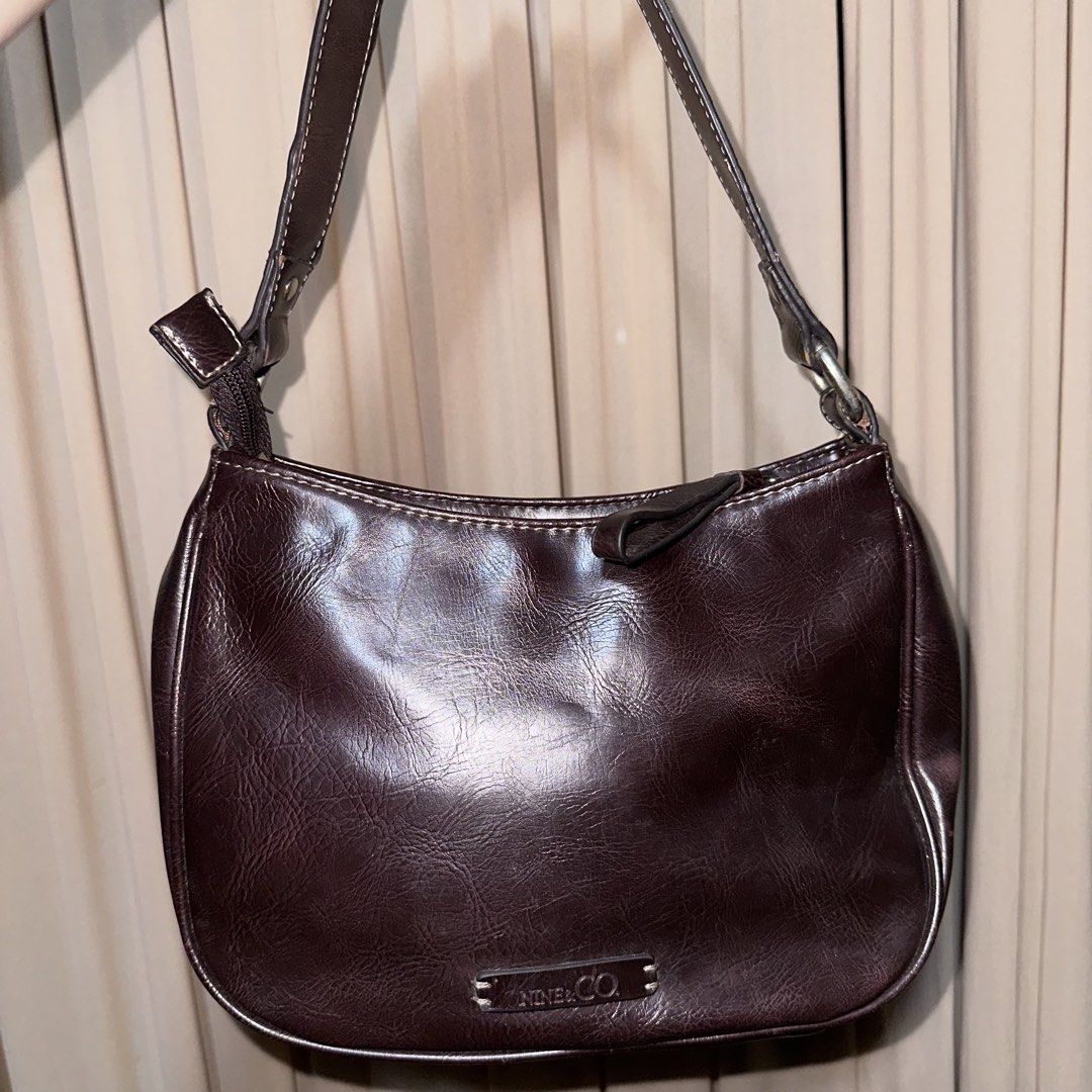 nine & co. brown shoulder bag (Category: Shoulder Bags) located in Pakil. Submitted by primrosehearts (Listing ID 1457858295, Image 2). Description: NOTE: MANAGE EXPECTATIONS - no noticeable signs of usage - in good condition - all closures working - beautiful brown color - bought in the us by my tita issue: - a bit of rust on the hardware - rubber lining needs to be glued (see last pic) L: 7” W: 10” 📍laguna mop: gcash mod: j&t sf is to be shoul