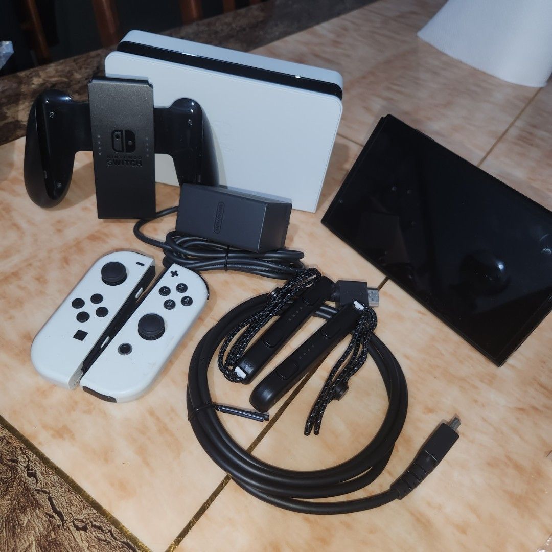 Nintendo Switch OLED White Console with Accessories (Category: Nintendo) located in Bulacan. Submitted by anna.t0 (Listing ID 1457902951, Image 1). Description: Nintendo Switch OLED Model (White) CONDITION: • Used but well taken care of • Has minimal scratches from normal use • Scratches are only cosmetic and do not affect gameplay or performance • No issues whatsoever — everything is working properly • Ready to use and play 📦 COMPLETE ACCESSORI