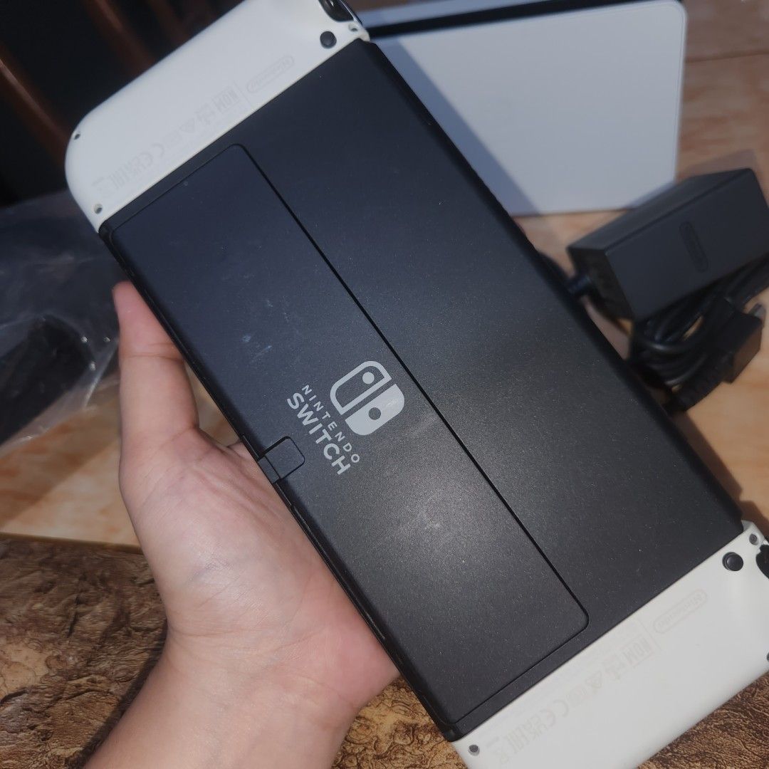 Nintendo Switch OLED White Console with Accessories (Category: Nintendo) located in Bulacan. Submitted by anna.t0 (Listing ID 1457902951, Image 3). Description: Nintendo Switch OLED Model (White) CONDITION: • Used but well taken care of • Has minimal scratches from normal use • Scratches are only cosmetic and do not affect gameplay or performance • No issues whatsoever — everything is working properly • Ready to use and play 📦 COMPLETE ACCESSORI