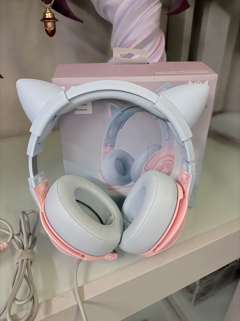ONIKUMA K9 Gaming Headset with Cat Ears (Category: Headphones & Headsets) located in Manila. Submitted by tinmah (Listing ID 1457740743, Image 2). Description: - Cute ONIKUMA K9 gaming headset - Available in pink and light blue - Adorable cat ear design (detachable) -RGB light - USB connector and durable braided cable - Soft and comfortable earcups for long wear - Ideal for gaming and music listening - Original box included.