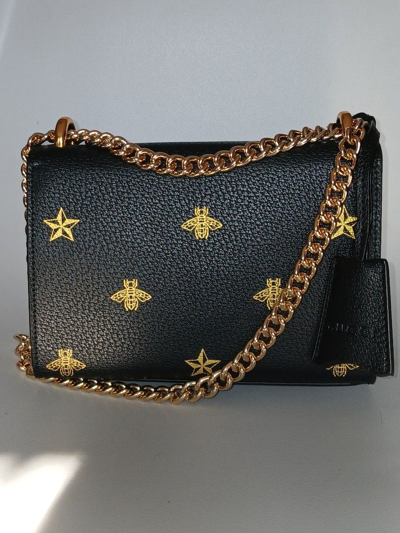 Padlock Black Leather Bee Star Chain Shoulder Bag (Category: Luxury Bags & Wallets) located in Paranaque City. Submitted by thepennydreadful (Listing ID 1457815913, Image 2). Description: - never worn just stored. in excellent condition. - Exquisite gold bee and star embroidery - Elegant gold chain strap and hardware - Secure front lock closure - Luxurious blue satin interior lining - Comes with original dust bag - Ideal for evening events or ele