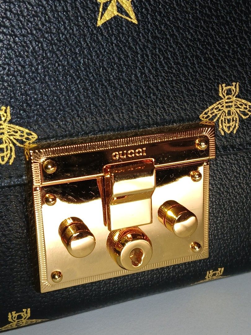 Padlock Black Leather Bee Star Chain Shoulder Bag (Category: Luxury Bags & Wallets) located in Paranaque City. Submitted by thepennydreadful (Listing ID 1457815913, Image 3). Description: - never worn just stored. in excellent condition. - Exquisite gold bee and star embroidery - Elegant gold chain strap and hardware - Secure front lock closure - Luxurious blue satin interior lining - Comes with original dust bag - Ideal for evening events or ele
