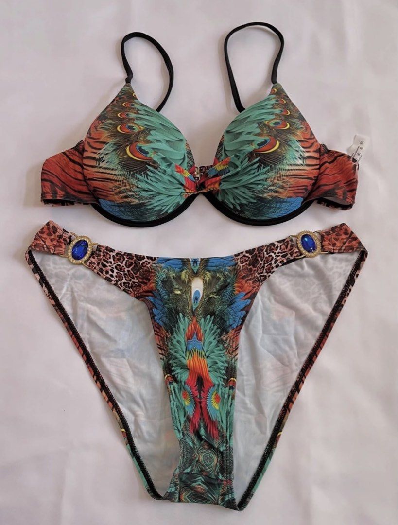 Peacock Feather Print Bikini Set with Embellishments (Category: Bikinis & Swimsuits) located in Davao. Submitted by chachaaarm (Listing ID 1457808847, Image 2). Description: Shein bikini set, XL. Peacock feather print with blue gem details on bottoms. Adjustable straps, underwire top. Great for beach/pool..