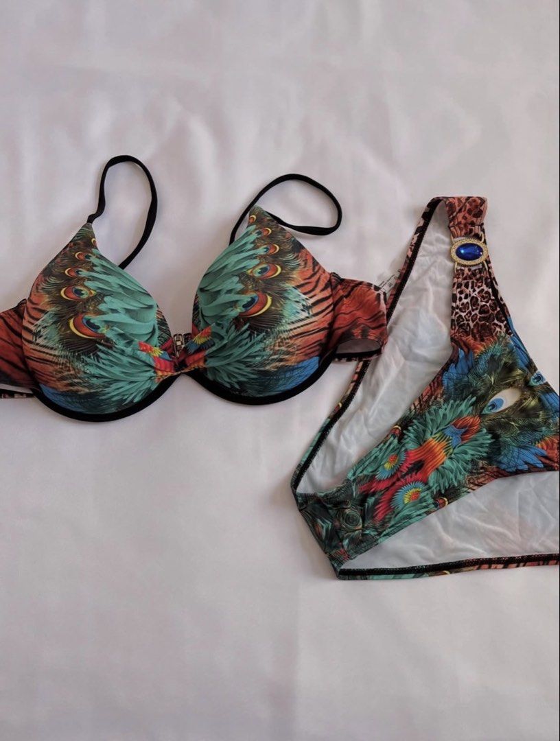 Peacock Feather Print Bikini Set with Embellishments (Category: Bikinis & Swimsuits) located in Davao. Submitted by chachaaarm (Listing ID 1457808847, Image 1). Description: Shein bikini set, XL. Peacock feather print with blue gem details on bottoms. Adjustable straps, underwire top. Great for beach/pool..