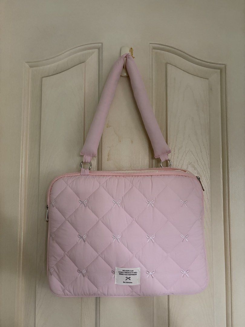 Pink Bow Puffy Laptop bag with detachable handle (Category: Laptop Bags & Sleeves) located in Paranaque City. Submitted by aripreloved_ (Listing ID 1457764761, Image 1). Description: .