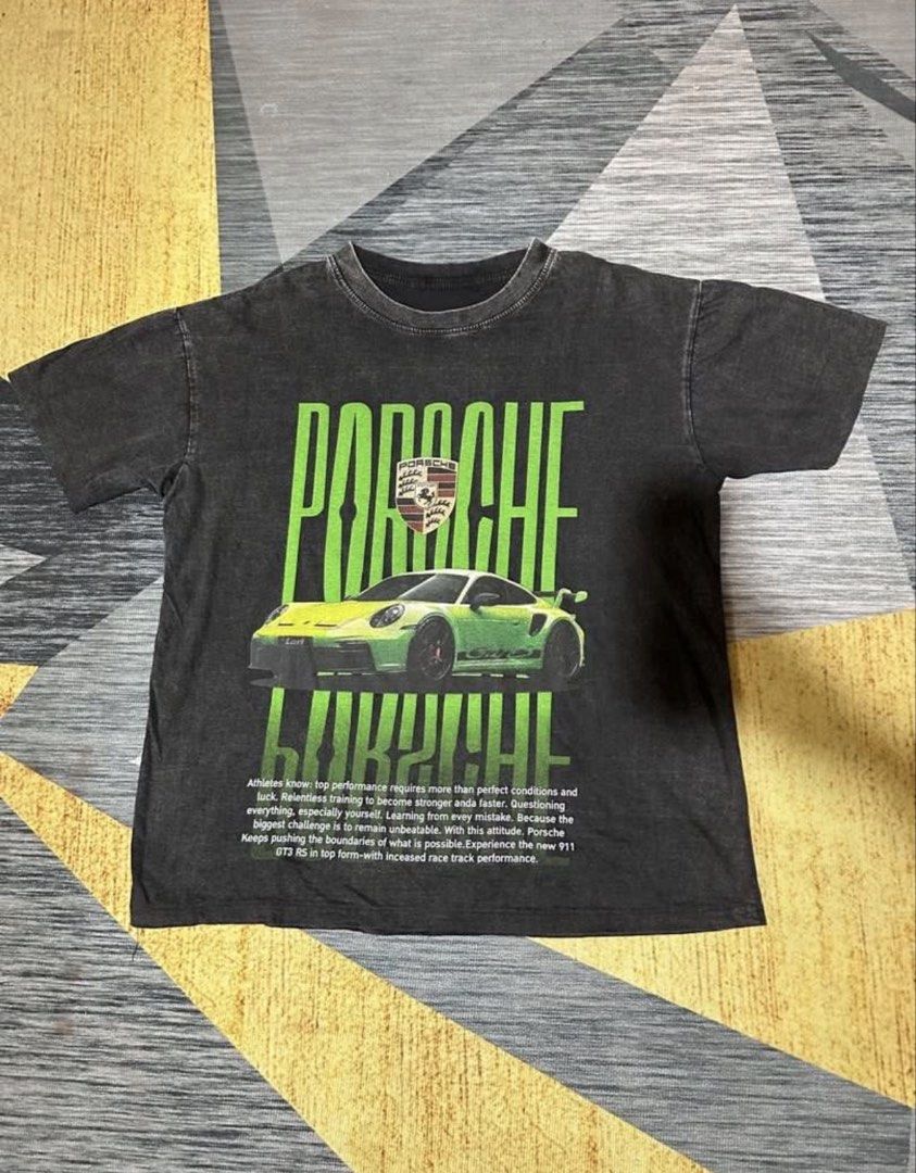 Porsche (Category: Tshirts & Polo Shirts ) located in Subic. Submitted by declutterbyshit (Listing ID 1457888367, Image 2). Description: 26x21.5 - Stylish washed black graphic t-shirt - Features a bold print of the Porsche 911 GT3 RS - Ideal for car fans and Porsche lovers.