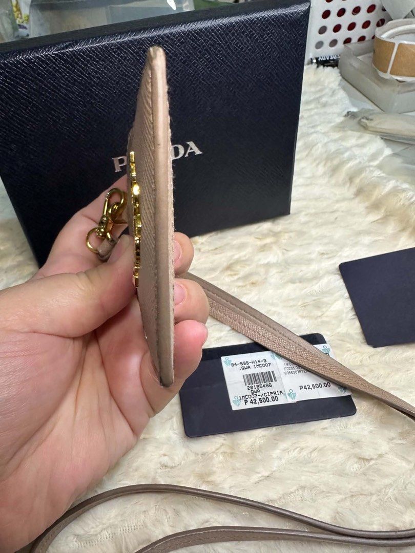 prada lanyard card holder (Category: Luxury Accessories) located in Manila. Submitted by ambercs (Listing ID 1457731204, Image 2). Description: auth prada lanyard with card slot preloved but in very good condition with box and cards cheapest in the market grab the chance🧡.