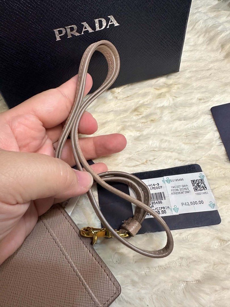 prada lanyard card holder (Category: Luxury Accessories) located in Manila. Submitted by ambercs (Listing ID 1457731204, Image 3). Description: auth prada lanyard with card slot preloved but in very good condition with box and cards cheapest in the market grab the chance🧡.