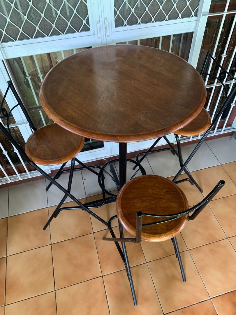 PRE-LOVED BAR TABLE + 3 HIGH CHAIRS SET (Category: Tables & Sets) located in Paranaque City. Submitted by juliusd23 (Listing ID 1457739222, Image 3). Description: Looking for a stylish and functional bar/dining set without spending a fortune? 🍻☕🍽️ Selling this pre-loved 4-piece Bar Table Set — 1 wooden bar table + 3 matching high chairs. ✨ WHAT YOU GET: • 1 Round Wooden Bar Table • 3 Matching High Chairs • Solid wooden tops/seats • Sturdy black
