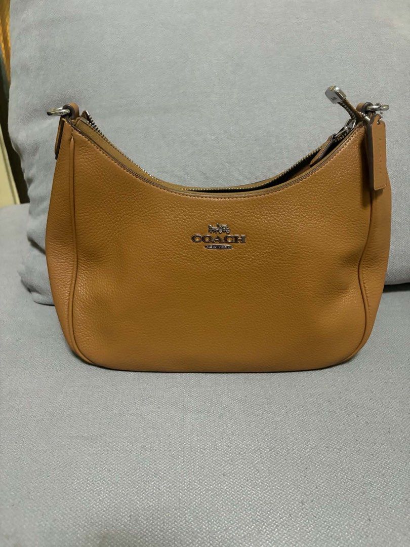 PRELOVED Coach Teri Hobo Bag (Category: Luxury Bags & Wallets) located in San Pedro. Submitted by misslumi (Listing ID 1457807535, Image 2). Description: PRELOVED Coach Teri Hobo Bag Light Saddle color with silver hardware. disclaimer: actual color of the bag might be slightly different on the photo due to lighting conditions. Pristine condition. Will pass as new. Part of my personal collection, barely used. MEASUREMENTS Length: 11.5" Height: 9.2
