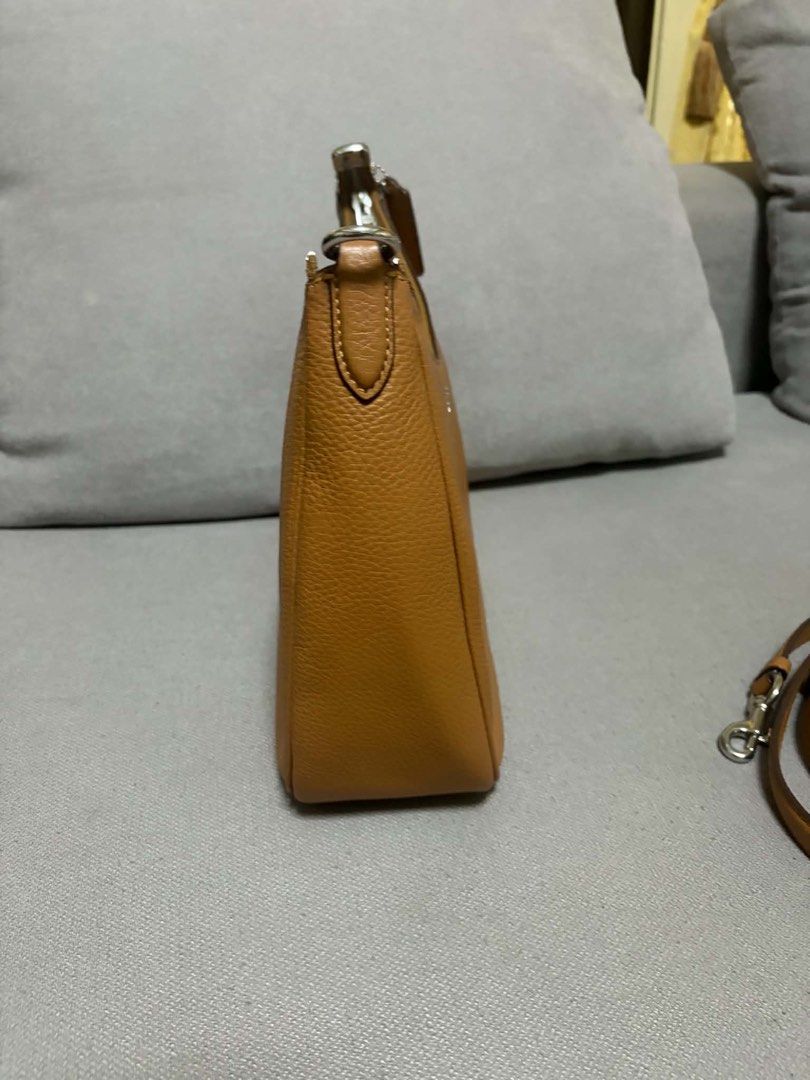 PRELOVED Coach Teri Hobo Bag (Category: Luxury Bags & Wallets) located in San Pedro. Submitted by misslumi (Listing ID 1457807535, Image 3). Description: PRELOVED Coach Teri Hobo Bag Light Saddle color with silver hardware. disclaimer: actual color of the bag might be slightly different on the photo due to lighting conditions. Pristine condition. Will pass as new. Part of my personal collection, barely used. MEASUREMENTS Length: 11.5" Height: 9.2