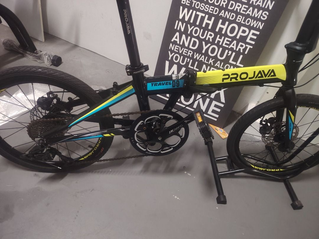 PROJAVA Folding Bicycle (Category: Bicycles) located in Singapore. Submitted by sunshine_7777 (Listing ID 1457858409, Image 3). Description: - PROJAVA folding bike - Black frame with yellow & blue accents - Front & rear disc brakes - Easy to fold and store - Ideal for commuting or casual cycling - Ready for your next ride!.