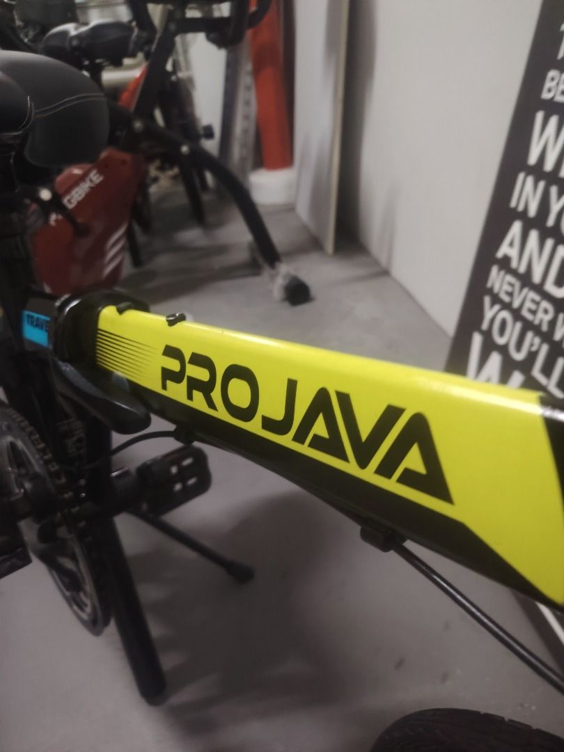 PROJAVA Folding Bicycle (Category: Bicycles) located in Singapore. Submitted by sunshine_7777 (Listing ID 1457858409, Image 5). Description: - PROJAVA folding bike - Black frame with yellow & blue accents - Front & rear disc brakes - Easy to fold and store - Ideal for commuting or casual cycling - Ready for your next ride!.