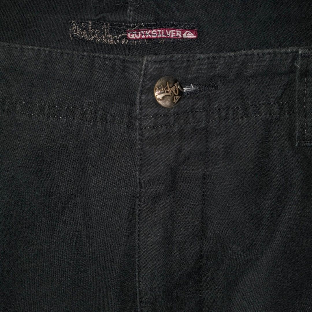 Quiksilver Cargo Shorts Size 34 Black (Category: Shorts) located in Manila. Submitted by ghst.thrift (Listing ID 1455642298, Image 2). Description: - Brand: Quiksilver - Color: Black - Size: 32 on tag 34 on measuring tape - Features: Graphic prints on pockets and waistband - Closure: Button and zip - Pockets: Multiple for ample storage - Ideal for: Casual wear, beach days.