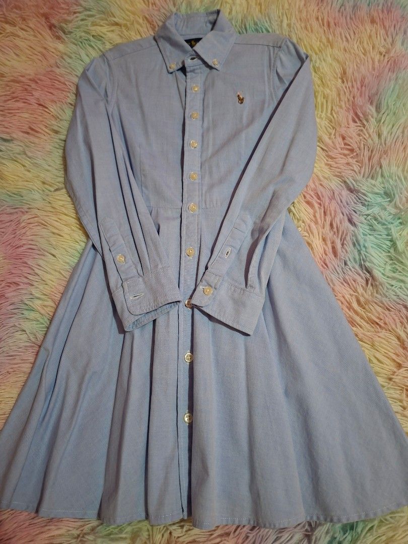 Ralph Lauren light blue logo dress (Category: Babies & Kids Fashion) located in Las Pinas. Submitted by assortedkidzstuffs (Listing ID 1457830043, Image 1). Description: This light blue cotton oxford shirt dress by Polo Ralph Lauren features a classic button-down front, long sleeves, and a flared pleated skirt accented with the brand's signature embroidered pony logo like new. worn once saglit tag size 7.