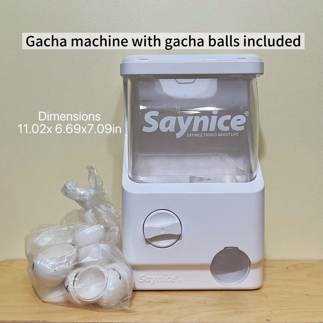 Saynice Gacha Machine with Gacha Balls Included (Category: Interactive Toys) located in Manila. Submitted by konpeito00 (Listing ID 1457724676, Image 1). Description: Saynice White Gacha Machine with gacha balls. Perfect for parties and fun surprises. Dimensions: 11.02 x 6.69 x 7.09 inches. Only Flaw missing upper cover.