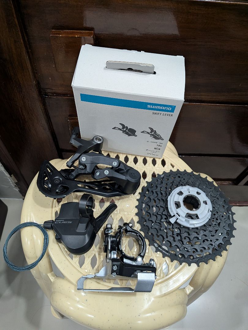 Shimano Cues 2x10 (Shifters+RD+FD+Cassette) (Category: Bicycles) located in Quezon City. Submitted by vincentpaul12 (Listing ID 1457775893, Image 1). Description: Shimano Cues 2x10 (Shifters+RD+FD+Cassette) - FD: Shimano Cues FD-U4000-L - RD: Shimano Cues RD-U6020-10 - Shifter (2x): Shimano Cues SL-U4000-L - Shifter (10s): Shimano Cues SL-U6000-10R (boxed) - Cassette: Shimano Cues CS-LG300-10 11-39T Condition: Brand new Location: SJDM, Bulacan.