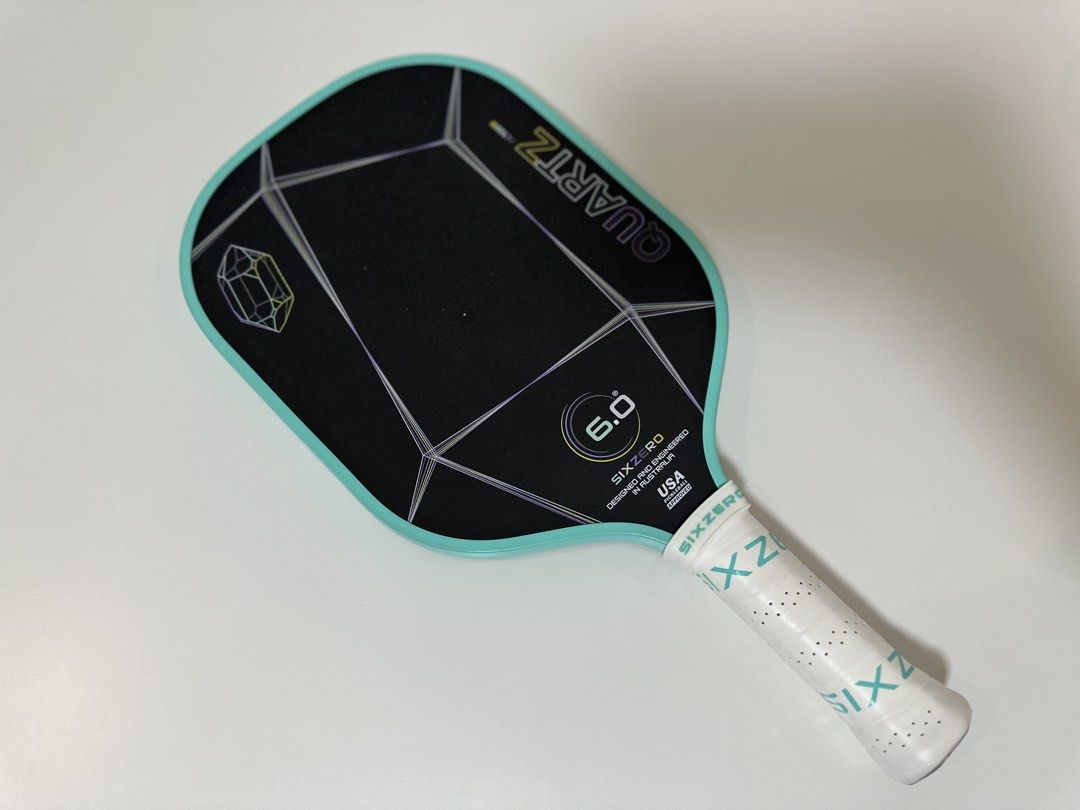 Six Zero Quartz Teal Pickleball Paddle (Category: Racket and Ball Sports) located in Quezon City. Submitted by ollietaba (Listing ID 1457872317, Image 1). Description: 15mm all-around paddle with a large sweet spot, great control, stability, power & pop. — Perfect for beginners to intermediate players — 4,000 Condition: — Minor scratches & small dents from regular use — barely noticeable once covered with a PPF — Signs of use on the handle since 