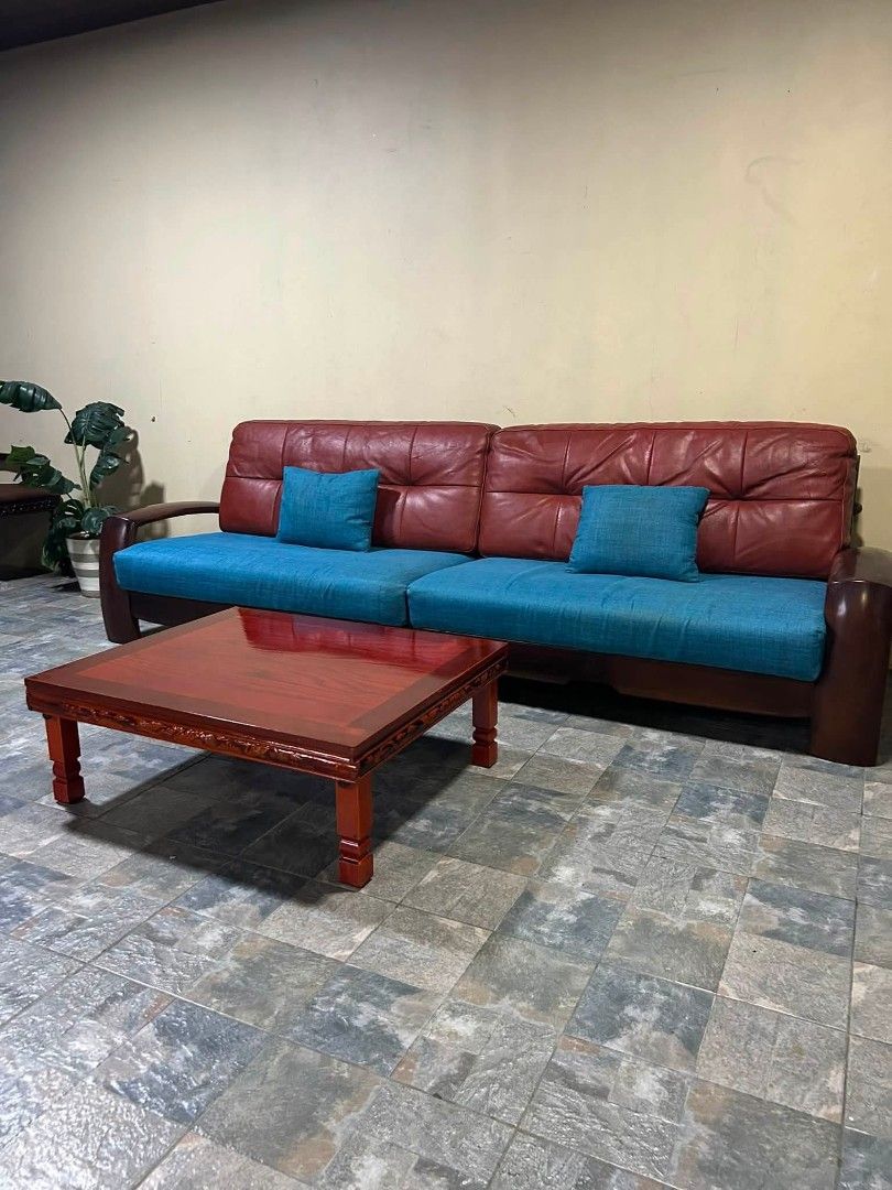 Sofa (Category: Sofas) located in Meycauayan. Submitted by marygracecasimiro (Listing ID 1457827259, Image 3). Description: Imported Solid Wood Sofa with Center Table from Korea P25,000 lang mga suki 109x38x38in/ Sofa 35x30x13in/ Center Table Solid Wood Genuine Leather With Pillows Washable Cover With Center Table Heavy Duty No issue Good Condition♥️💚 Minor Scratch From Korea.