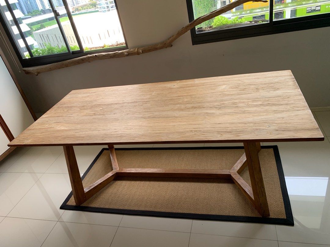 Solid Wood Dining Table (Category: Tables & Sets) located in Singapore. Submitted by j3meowPunggol (Listing ID 1457758883, Image 2). Description: This is a reclaimed teakwood dining table measuring 2.2m x 1m. A rare beauty with natural teakwood grains and solid legs! Definitely a centrepiece in the living room to seat 8 guests comfortably. Price does not include transport. .