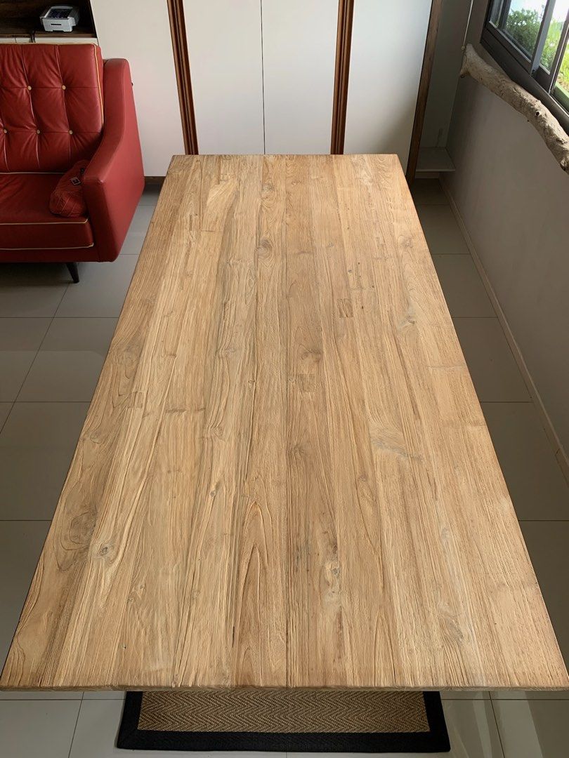 Solid Wood Dining Table (Category: Tables & Sets) located in Singapore. Submitted by j3meowPunggol (Listing ID 1457758883, Image 3). Description: This is a reclaimed teakwood dining table measuring 2.2m x 1m. A rare beauty with natural teakwood grains and solid legs! Definitely a centrepiece in the living room to seat 8 guests comfortably. Price does not include transport. .
