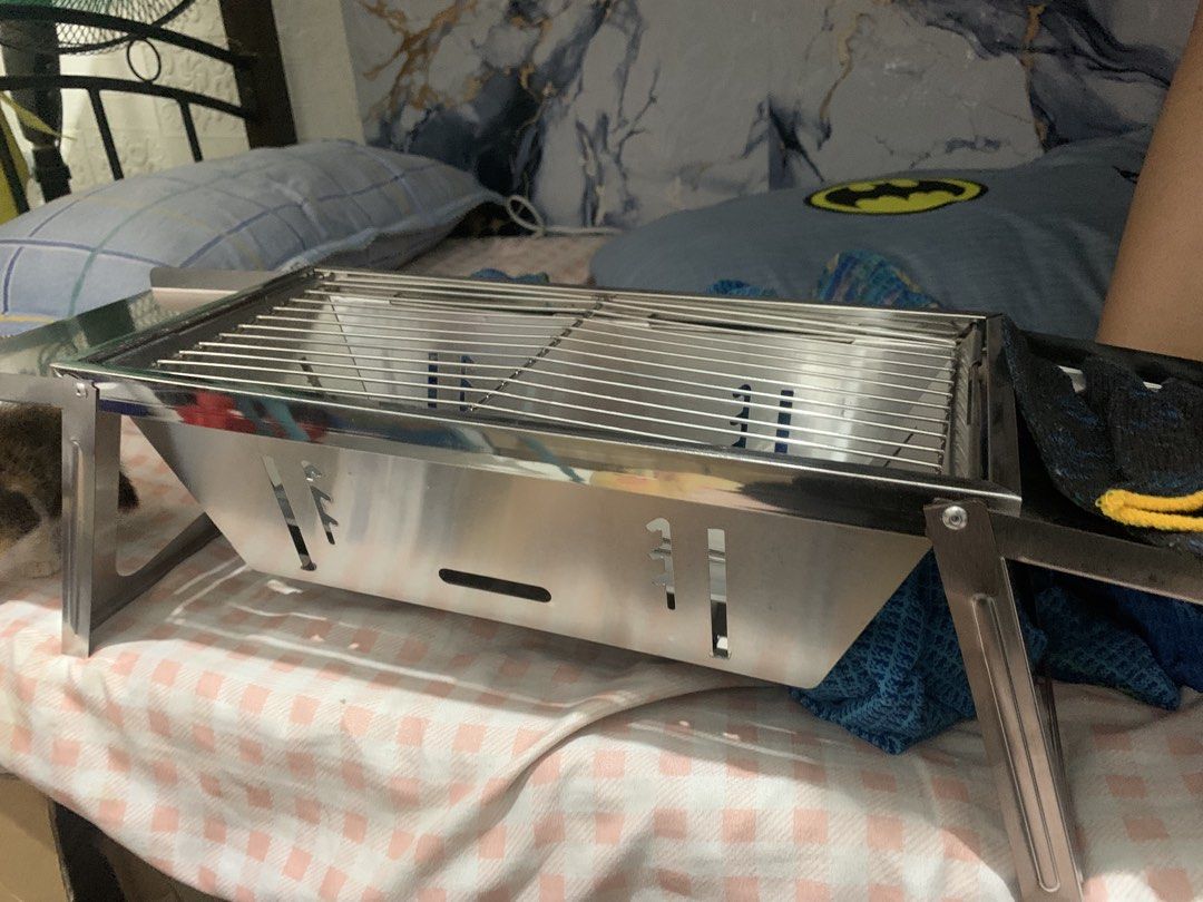 Stainless Steel Portable Foldable BBQ Grill (Category: BBQ, Grills & Hotpots) located in Bulacan. Submitted by celinexxxbuyer (Listing ID 1457887521, Image 1). Description: - Compact stainless steel BBQ grill -Foldable - Folds flat for easy storage and transport - Ideal for picnics, camping, and backyard grilling - Simple setup and cleaning - Durable construction for long-lasting use - Get ready for your next outdoor cookout! INCLUSION: Gloves Ec
