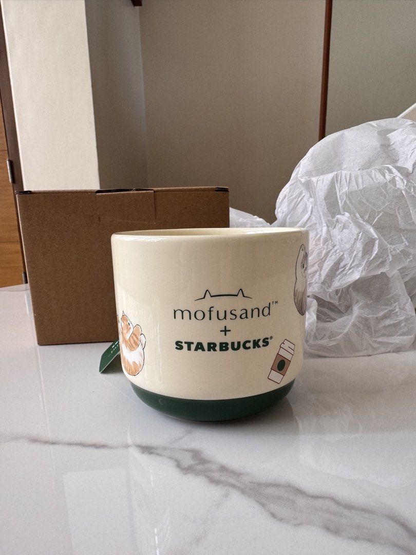 Starbucks x Mofusand Cat Mug (Category: Coffee & Tea Tableware) located in Manila. Submitted by kkc.55 (Listing ID 1457740896, Image 3). Description: ONHAND NOW!!! Limited stocks Starbucks x Mofusand Cat Mug ( with box ) Limited stock Mode of payment : MAYA or GCASH - Super cute Starbucks x Mofusand collaboration mug - 12oz Mug - Features adorable Mofusand cat illustrations all around - Cream colored with a stylish dark green base - Comes with or