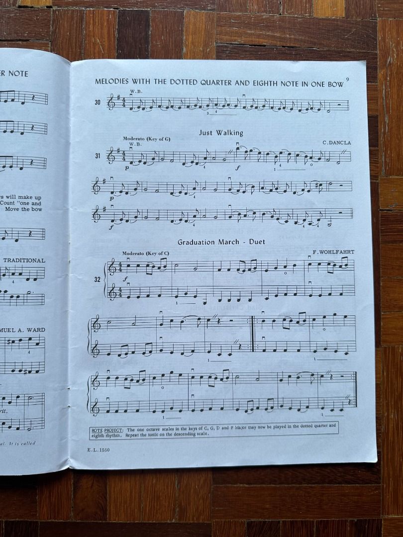 String Builder Book 2 (Category: Textbooks) located in Shah Alam. Submitted by fromkaela (Listing ID 1457783143, Image 2). Description: - Violin sheet music book with a variety of pieces. - Features include 'Melodies with the Dotted Quarter and Eighth Note in One Bow', 'Just Walking', and 'Graduation March - Duet'. - Includes essential exercises like scales in C, G, D, and E Major. - Ideal for violin practice and learning new repertoire. - Note: 