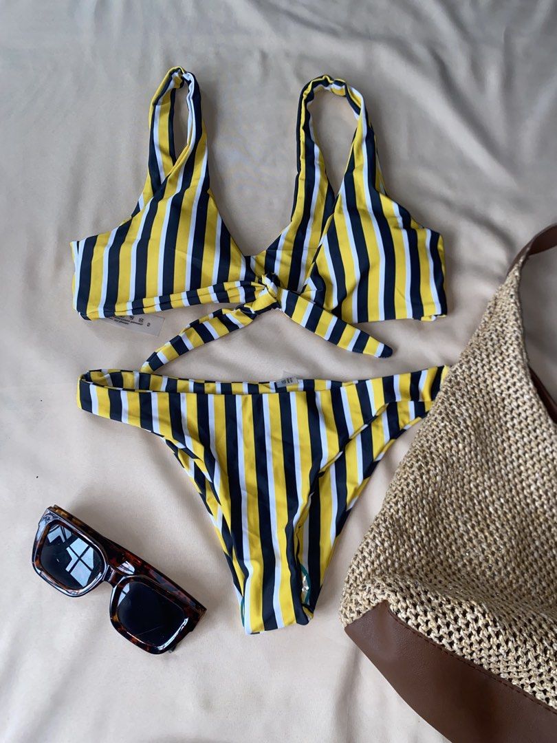 Striped Bikini Set - Yellow, Black, White (Category: Bikinis & Swimsuits) located in Tarlac. Submitted by rieselects (Listing ID 1456579699, Image 1). Description: - Cute striped bikini set - Features a tie-front top - High-waisted bottoms - Yellow, black, and white stripe pattern - Ideal for beach or pool days - Comfortable and stylish design - Perfect for your next vacation!.