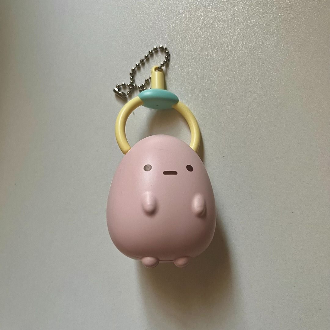 Sumikko Gurashi Pink Tapioca Hanging Around Keychain Charm (Category: Character Goods) located in Taguig. Submitted by cloudyish_skies (Listing ID 1457733174, Image 1). Description: - Adorable pink penguin charm from Sumikko Gurashi. - Features a cute yellow ring. - Comes with a silver ball chain for easy attachment. - Ideal for decorating bags, backpacks, or as a keychain. - Small, portable, and a must-have for Sumikko Gurashi fans! - san-x.
