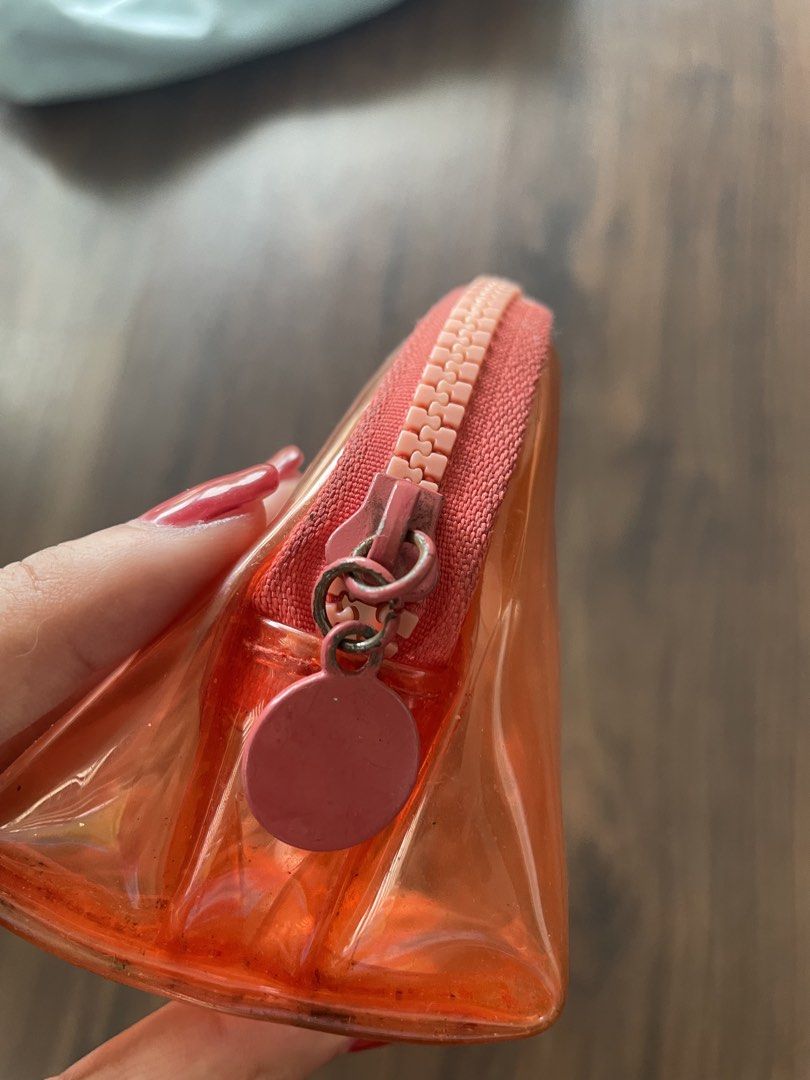 sunnies face jelly pouch orange original (Category: Purses & Pouches) located in Quezon City. Submitted by andreaaa_______ (Listing ID 1457785275, Image 3). Description: og color from 2018/2019 not being produced anymore marks from wear and tear no issues w pouch itself or zipper purchased in UPTC 2018/2019.
