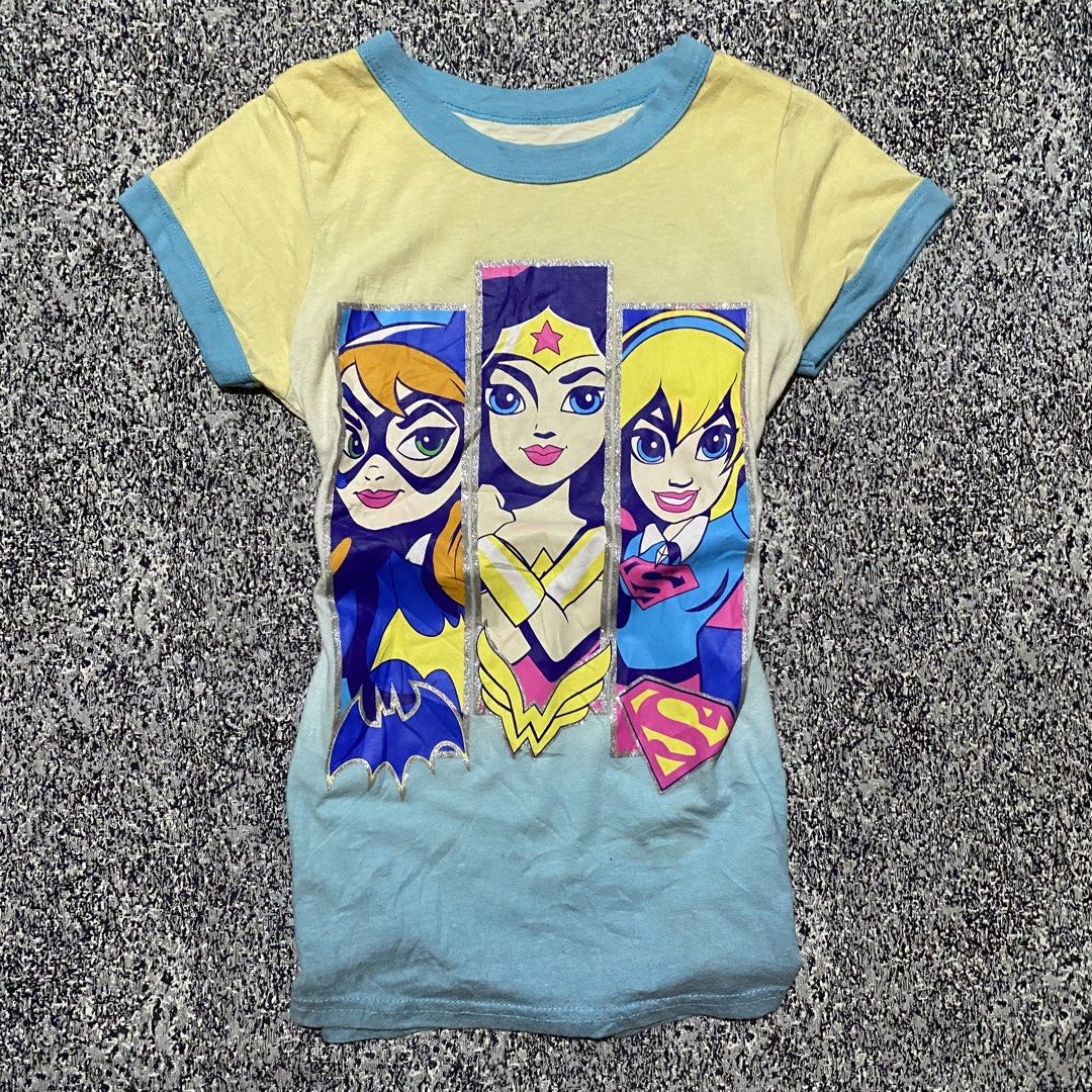 Super hero tees (Category: Shirts) located in Quezon City. Submitted by semantaryrave (Listing ID 1457801862, Image 1). Description: Super hero tees Size large Good condition Width- 14 Length- 23 .