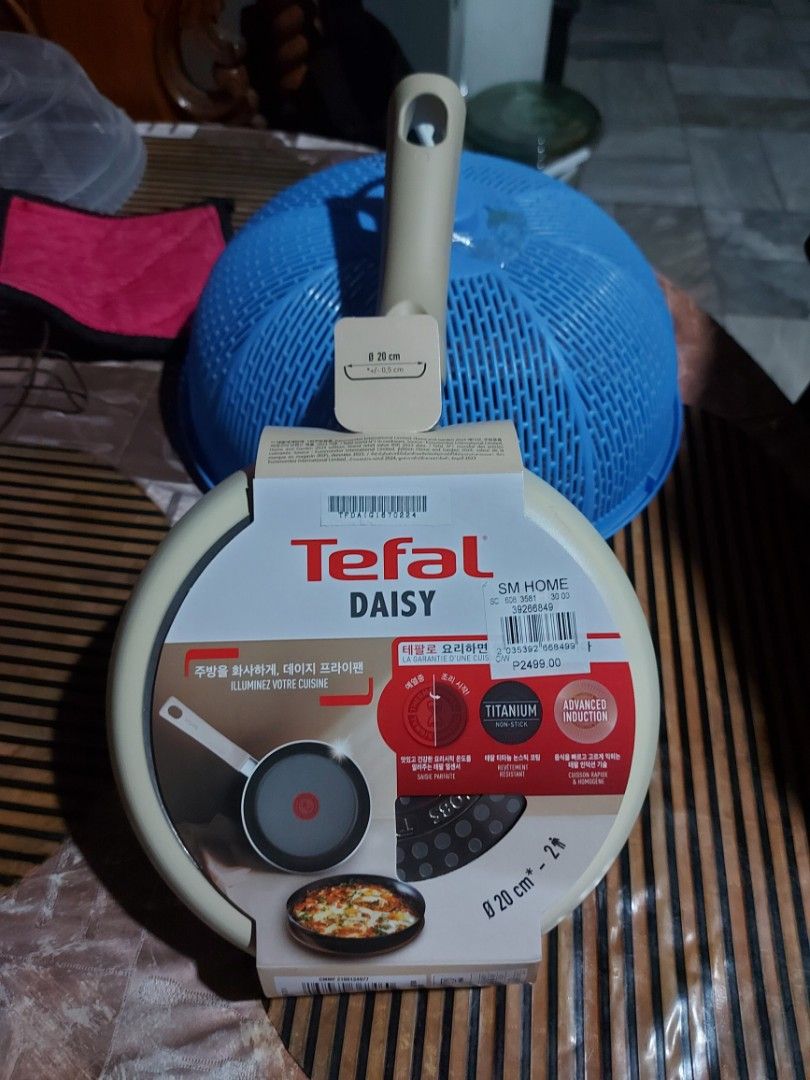 Tefal Daisy Titanium Non-Stick Frying Pan 20cm (Category: Cookware & Accessories) located in Manila. Submitted by veelafiera (Listing ID 1457819151, Image 2). Description: - Tefal Daisy Frying Pan - 20cm size - Durable Titanium Non-Stick Coating - Advanced Induction Base - suitable for all stovetops (gas, electric, ceramic, induction) - Perfect for everyday cooking - Comes in original packaging - with generic (not tefal brand) cover.